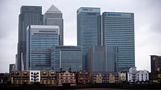 An exterior view shows the headquarters building of Barclays Bank, 1 Churchill Place, at right, in the Canary Wharf business district of London, Thursday, May 8, 2014. 