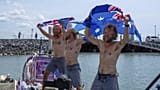 Scottish brothers, Ewan, Jamie and Lachlan, Maclean react after completing their record breaking row from Peru across the Pacific Ocean to Cairns, Australia, Saturday, Aug. 30
