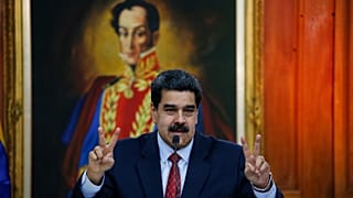FILE: Venezuelan President Nicolas Maduro holds up victory signs, as he says he will come out victorious amid a "coup," in Caracas, 25 January 2019