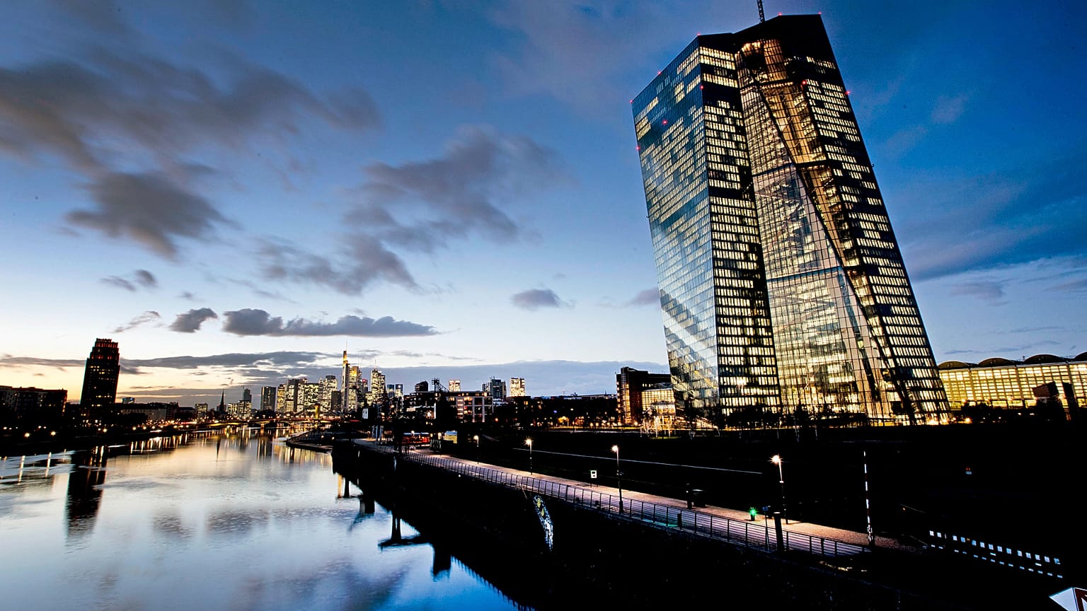 The European Central Bank, right, is seen next to the river Man in Frankfurt, Germany.