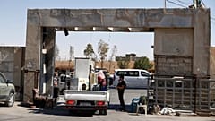 An Alawite family leaves their home passing through a checkpoint of Syrian government security forces in Sumaria, a suburb northwest of Damascus, 30 August 2025