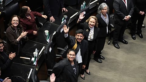 Mexico's incoming Supreme Court members wave during their swearing-in ceremony at the Senate in Mexico City, Monday, Sept. 1, 2025.