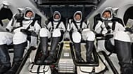 In this photo provided by NASA, a cosmonaut and astronauts are seen in a SpaceX spacecraft shortly after having landed in the Pacific Ocean near California on Aug. 9, 2025.