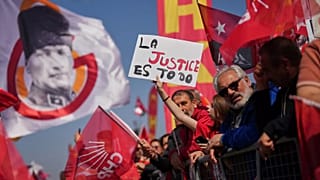 People listen to speeches during a rally called by Republican People's Party in Istanbul, 29 March, 2025
