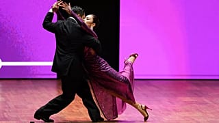 A couple competes in the stage category finals of the World Tango Championship, in Buenos Aires, Argentina, Tuesday, Sept. 2, 2025.