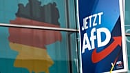 An election poster of the German far right Alternative for Germany party (AfD) in front of a giant election poster showing a map of Germany, Jan. 29, 2025