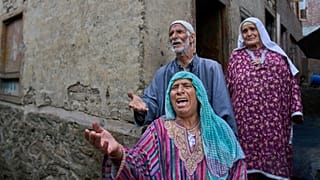 Kashmiri women and a man ask for help after leaving their home inundated by floodwaters in Theed village of Srinagar, Indian-controlled Kashmir, Sept. 3, 2025. 