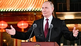 Russian President Vladimir Putin gestures during a press conference in Beijing, 3 September 2025