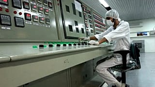 A technician works at the Uranium Conversion Facility just outside the city of Isfahan, 3 February, 2007