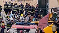 Emergency teams work at the site of a derailed electric streetcar in Lisbon, 3 September 2025