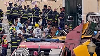 Emergency teams work at the site of a derailed electric streetcar in Lisbon, 3 September 2025
