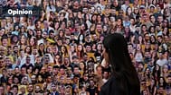 FILE: An attendant walks through a mural with portraits of the victims at the site of the Nova music festival, killed and abducted by Hamas and taken into Gaza, 7 October 2024