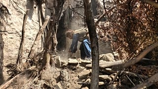 A man tries to clear rubble of a collapsed house after a powerful earthquake struck eastern Afghanistan, 3 September, 2025