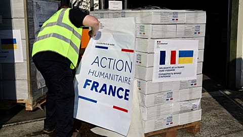 A worker prepares French humanitarian aid to Ukraine in June 2023.