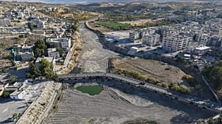 A drone view shows the dried up Orontes River in Jisr al-Shughur, west of Idlib, Syria.