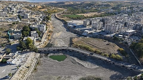 A drone view shows the dried up Orontes River in Jisr al-Shughur, west of Idlib, Syria.