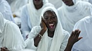 A woman recites prayers as people mark Prophet Muhammad's birthday, known as Mawlid, in Dakar, Senegal, Friday, Sept. 5, 2025.