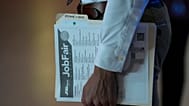 FILE - A person waits in a line for a prospective employer at a job fair, Thursday, 29 August 2024, in Sunrise, US.