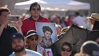Pilgrims arrive with a portrait of Carlo Acutis for the canonisation Mass of Acutis and Pier Giorgio Frassati in St Peter's Square at the Vatican, 7 September 2025
