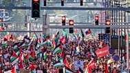 People wave Palestinian flags as they march during a demonstration in the center of Brussels, Sunday, Sept. 7, 2025.