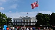 Visitors walk outside of the White House on 13 July, 2025. 