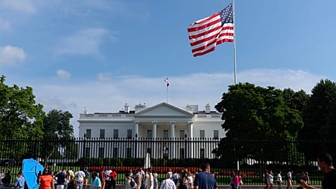Visitors walk outside of the White House on 13 July, 2025. 