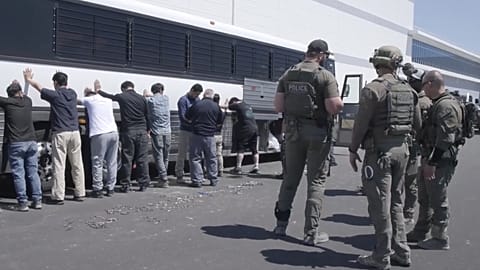 Manufacturing plant employees have their legs shackled at the Hyundai Motor Group’s electric vehicle plant in Georgia on 4 September, 2025. 