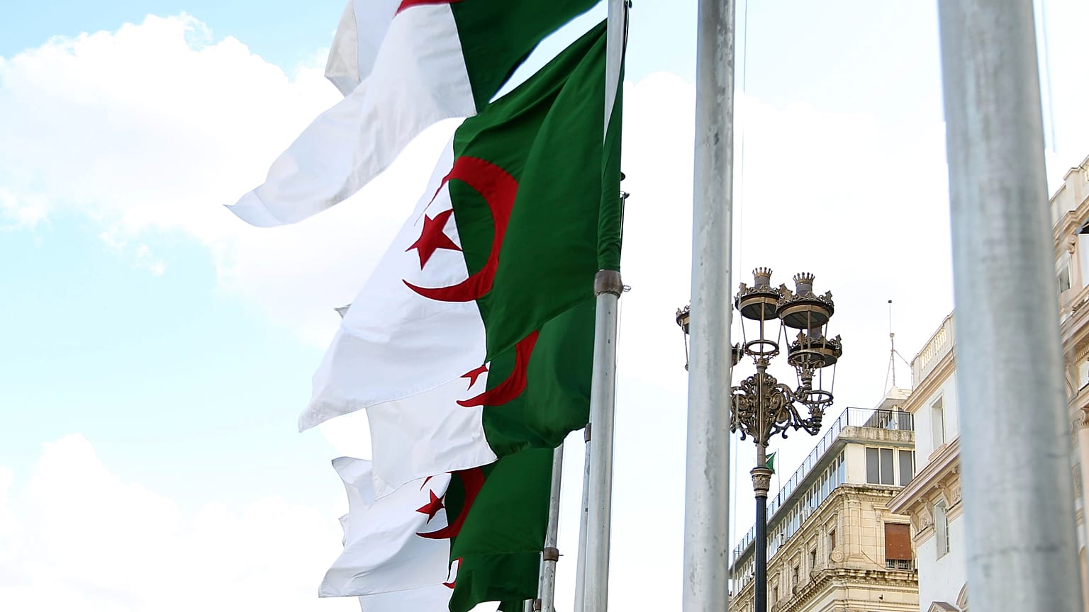 FILE: Algeria's flags fly in Algiers, 16 April 2025