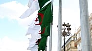 FILE: Algeria's flags fly in Algiers, 16 April 2025