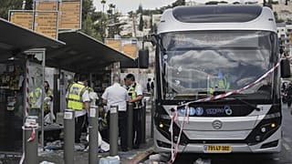Israeli police and rescue teams inspect the scene of a shooting attack carried out by two gunmen, in which several people were killed, in Jerusalem, Monday, Sept. 8, 2025.
