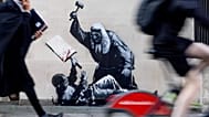 Judge, jury and executioner - Bansky's latest mural shows a judge using his gavel to hit a protester