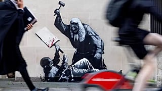 Judge, jury and executioner - Bansky's latest mural shows a judge using his gavel to hit a protester