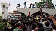 Protesters shout slogans as they gather outside the Parliament building in Kathmandu, Nepal, Monday, Sept. 8, 2025. 