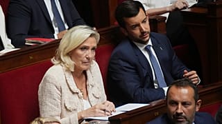 French far-right leader Marine Le Pen listens to the speech of French Prime Minister Francois Bayrou at the National Assembly