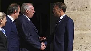 France's President Emmanuel Macron, right, shakes hand with France's Prime Minister Francois Bayrou, Paris, France, Friday, Sept. 5, 2025.