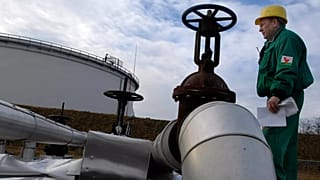  Istvan Szekeres, engineer of the Hungarian Oil and Gas Company (MOL) checks the receiving area of the Druzhba oil pipeline in the country's largest oil refinery in Szazhalomb
