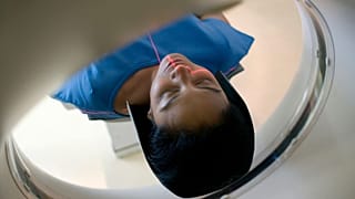 A woman undergoes a CT scan.
