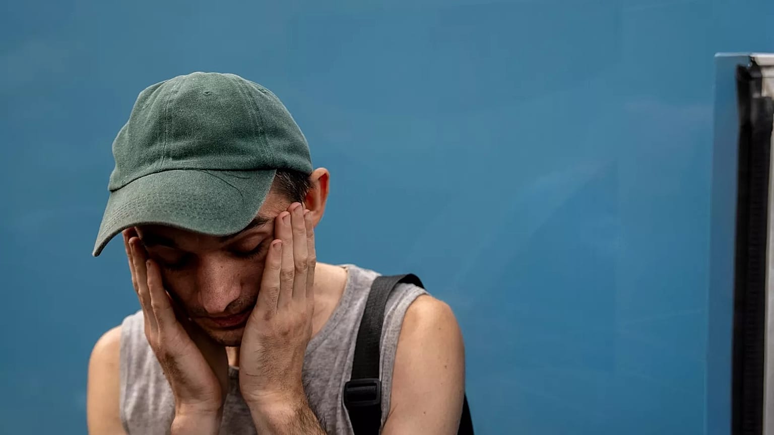 Dmytro Trush, who lost his mother, reacts while being evacuated from the village of Yarova, 9 September, 2025