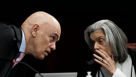 Supreme Court Justices Alexandre de Moraes, left, and Carmen Lucia speak during the verdict hearing, in Brasilia, Brazil, Tuesday, Sept. 9, 2025.