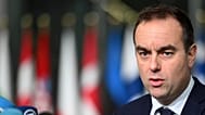 French Defence Minister Sebastien Lecornu speaks with the media as he arrives for a meeting of NATO defence ministers in Brussels, 13 February, 2025