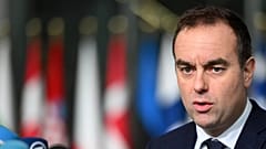 French Defence Minister Sebastien Lecornu speaks with the media as he arrives for a meeting of NATO defence ministers in Brussels, 13 February, 2025
