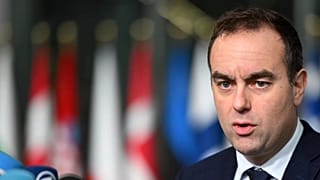 French Defence Minister Sebastien Lecornu speaks with the media as he arrives for a meeting of NATO defence ministers in Brussels, 13 February, 2025