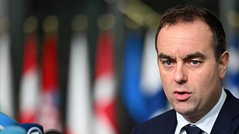 French Defence Minister Sebastien Lecornu speaks with the media as he arrives for a meeting of NATO defence ministers in Brussels, 13 February, 2025