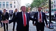 President Donald Trump speaks to reporters before he enters a restaurant near the White House, Tuesday, Sept. 9, 2025.