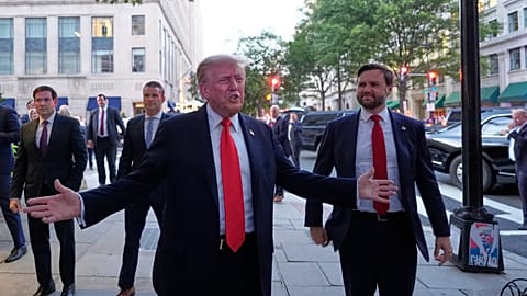 President Donald Trump speaks to reporters before he enters a restaurant near the White House, Tuesday, Sept. 9, 2025.