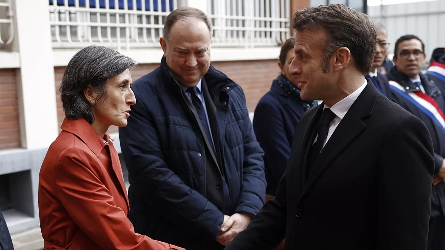 Director of the DGSI (Direction generale de la securite interieure), Celine Berthon shakes hands with French President Emmanuel Macron, 11 March 2025.