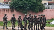 Nepalese army men stand guard