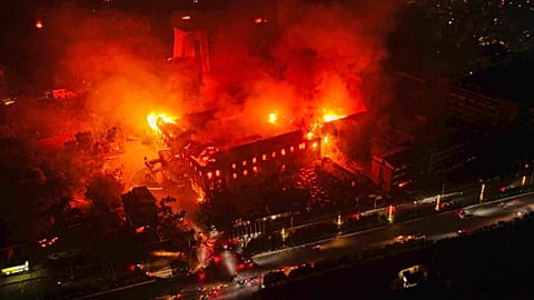 Flames come out from the residence of Nepal President Ram Chandra Poudel after it was set on fire by protesters in Kathmandu, 9 September 2025