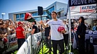 Charlie Kirk hands out hats before speaking at Utah Valley University in Orem, Utah, Wednesday, Sept. 10, 2025