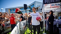 Charlie Kirk hands out hats before speaking at Utah Valley University in Orem, Utah, Wednesday, Sept. 10, 2025